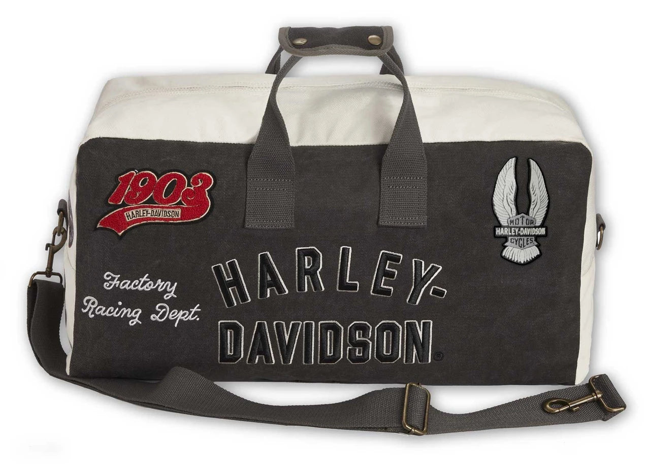 Borsa da viaggio vintage Harley-Davidson® con molteplici toppe e loghi, realizzata in tela resistente.