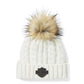 Cappello con pompon e toppa in pelle